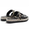 Slippers in black leather with fabric decorations
